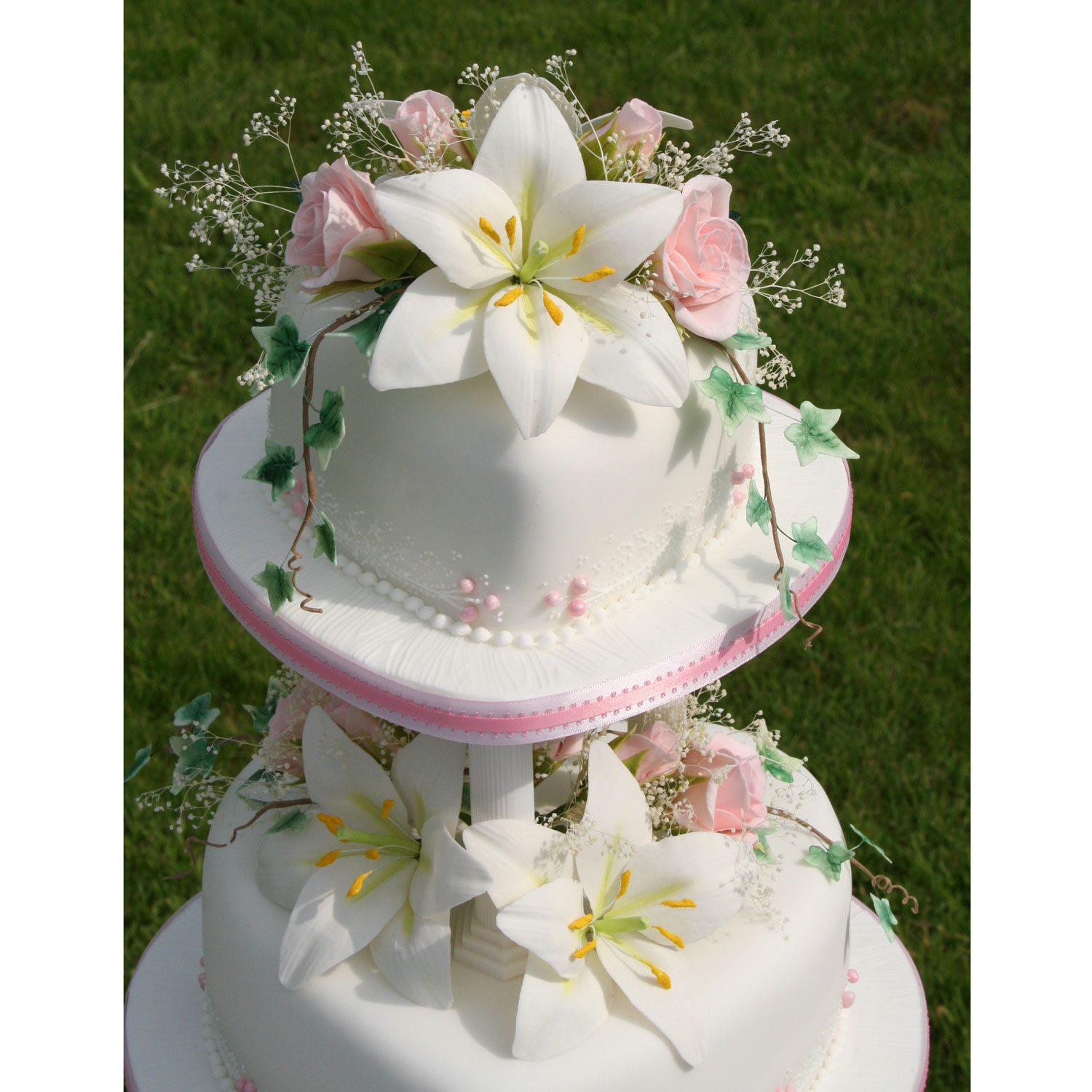 Sam Love Heart Shaped Wedding Cake Tiers with hand made flowers.